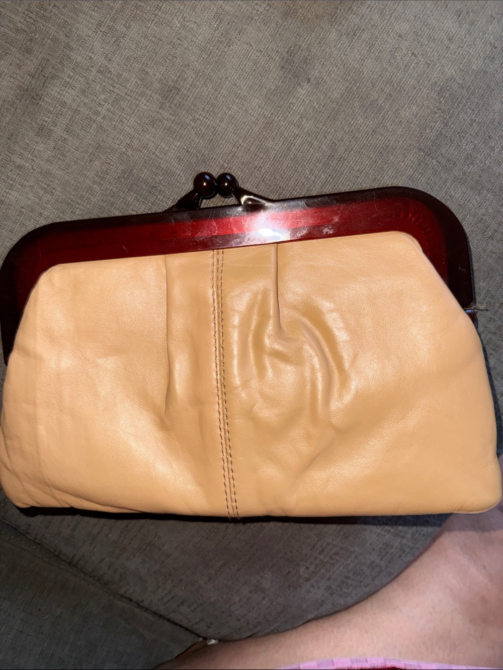 vintage tan clutch handbag featuring a tortoiseshell-style lucite framei